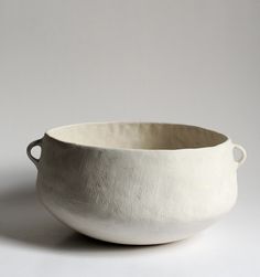 a white bowl sitting on top of a table