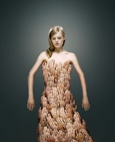 a woman in a dress made out of hands