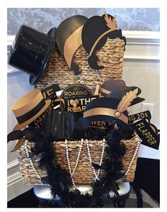 a basket filled with black and gold items