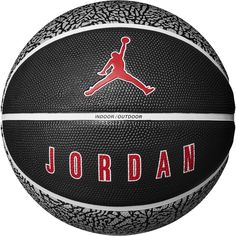 the jordan basketball is shown in black and white, with red lettering on the side