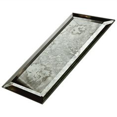 a rectangular metal tray with marble inlays