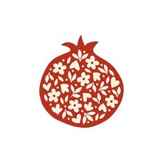 a red pomegranate with white flowers and leaves on the top is shown