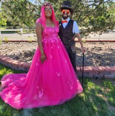 a man and woman dressed up in costumes