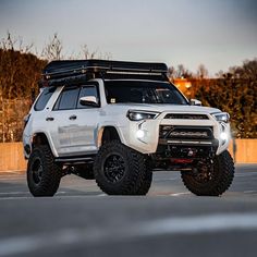 a white toyota truck parked in a parking lot