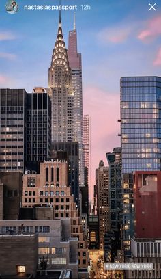 there is a very tall building in the middle of this city at sunset or dawn