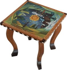 a small wooden table with a painting on it