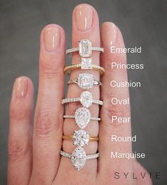 a woman's hand with five different types of rings on it and the words, emerald princess cushion oval pear round marquee