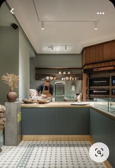 a man is in the kitchen preparing food