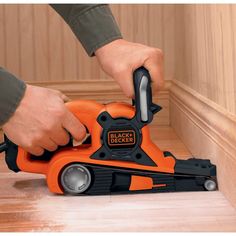 a person using a black and decker jig saw