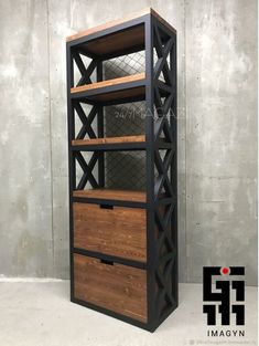 an industrial shelving unit with wooden drawers and black metal frame, in front of a concrete wall