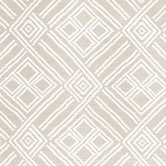 a beige and white rug with an abstract design