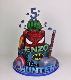 a spiderman cake with the number five on it