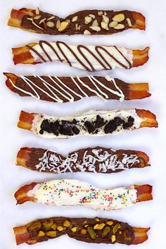 five different types of bacon wrapped in chocolate and sprinkled with white frosting