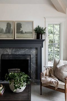 a living room filled with furniture and a fire place in front of a painting on the wall