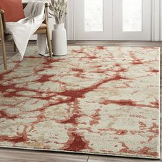 a red and white rug in a living room