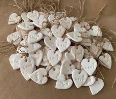 white ceramic heart ornaments tied with twine