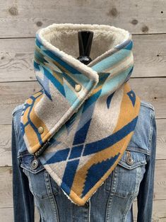 a denim jacket with a scarf on top of it