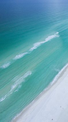 an aerial view of the beach and ocean