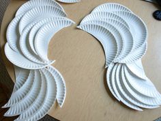 paper plates are arranged in the shape of wings