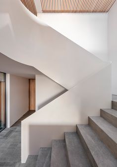 the stairs in this modern house are made of concrete