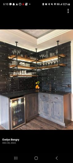 a kitchen with black and white tile on the backsplash is shown in this image