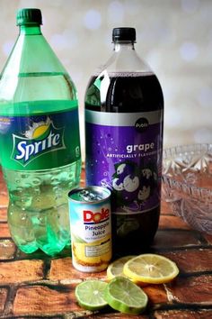 two bottles of soda, lemon and lime slices on a table