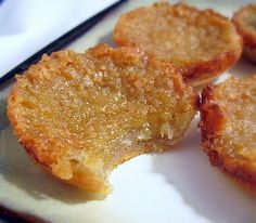 two pieces of fried food on a white plate