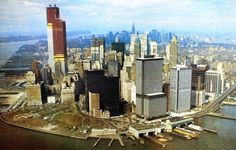 an aerial view of new york city with skyscrapers and other buildings in the foreground