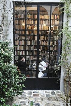 an open door to a book store filled with books