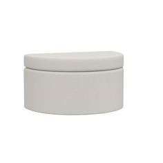 a white round container sitting on top of a table