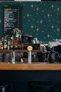 the bar is full of liquor bottles and other things to drink on it's counter