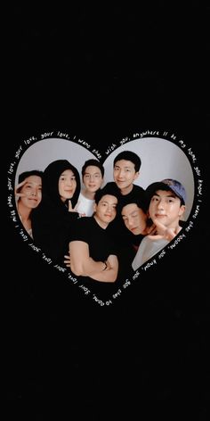 a group of people in the shape of a heart