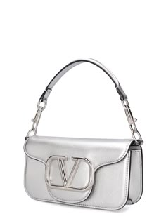 Find VALENTINO Locò Top Handle Bag on Editorialist. The VALENTINO GARAVANI Locò Top Handle Bag features a metal chain strap, a detachable leather top handle, and a front flap closure with a metal logo detail. The bag measures 11cm in height, 20cm in width, and 5cm in depth. The strap drop is 51cm and the handle drop is 11cm. Ski Accessories, Beige Style, Valentino Bags, Sports Accessories, Metal Logo, Metallic Logo, Handle Bag, Leather Top, Pink Bag