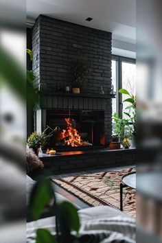 Chic Black Brick Fireplace Ideas for Cozy Homes Black Fireplace Surround Ideas, Moody Brick Fireplace, Fireplace Surround Ideas, Brick Fireplace Ideas, Brick Fireplace Decor, Black Fireplace Surround, Black Brick Fireplace, Painted Brick Fireplaces, Fireplace Cover