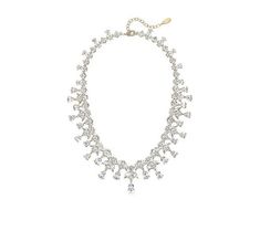 Dazzle and shine on your special day with this statement necklace that promises to add a glamorous touch to your bridal look. Crafted with an exquisite array of Diamonique simulated diamonds, this necklace is the epitome of elegance and sophistication, ensuring all eyes are on you. Glamorous Sparkling Crystal Bridal Necklace, Glamorous Sparkling Bridal Necklace, Elegant Crystal Embellished Necklaces For Anniversary, Glamorous Formal Backdrop Necklace, Glamorous Necklaces With Sparkling Stones, Glamorous Cubic Zirconia Jeweled Bridal Necklace, Glamorous Cubic Zirconia Bridal Necklace With Jewels, Glamorous Necklace With Sparkling Stones, Glamorous Bridal Necklace With Jewels In Cubic Zirconia