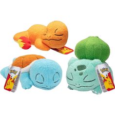 three stuffed animals with different colors and shapes