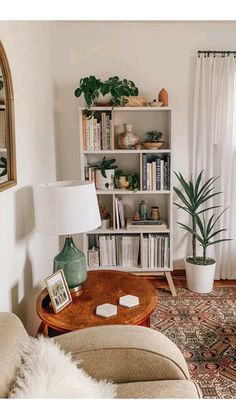 a living room filled with lots of furniture and bookshelves