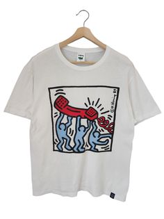 a white t - shirt with an image of a jellyfish on it