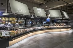 the inside of a deli filled with lots of food