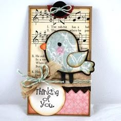 a card with a bird on it and music notes in the background that says thinking of you