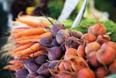 a pile of carrots sitting on top of a table