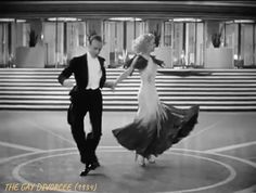 a man and woman are dancing on the dance floor in an old fashion ballroom scene