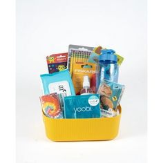 a yellow basket filled with lots of different items