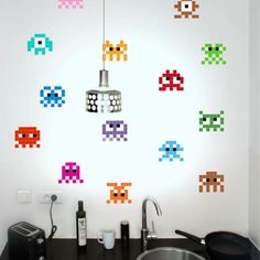 an image of a bathroom setting with pacman stickers on the wall and sink