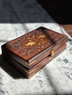 a wooden box sitting on top of a table