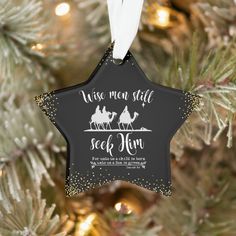 a christmas ornament hanging on a tree with the words wise men still seek him