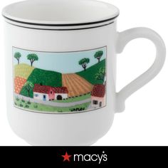 a white coffee mug with a farm scene painted on the front and side, along with a black stripe around the bottom