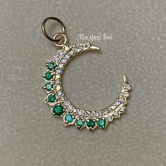 "Thank you for coming in! Genuine 14K GOLD diamond natural emerald charm pendant. This particular Yellow gold large moon charm has small diamond accents(0.25 carat) and natural emerald stones(0.44 carat) on it! THEY ARE STAMPED WITH \"14K 0.25ct\", but I could not show it clearly in the pictures. Amazing quality diamonds and finest green emerald stones in this piece!  DIMENSION: 18mmx24.5mm including 3.5mm jump ring, plus 6.3 mm top bail loop, 4.5mm hole MATERIAL: 14K Yellow Gold,  natural diamond, natural emerald" Gold Emerald Jewelry With Single Cut Diamonds, Luxury Gold Emerald Jewelry With Single Cut Diamonds, Green Necklace With Moon Charm, Green Moon Charm Round Necklace, Green Moon Charm Necklace, Green Celestial Round Jewelry, Gold Jewelry With Single Cut Diamonds For May Birthstone, Green Round Pendant Jewelry With Diamond Accents, Cubic Zirconia Moon Charm Pendant Jewelry