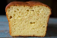 a piece of bread that has been cut in half and is sitting on a table