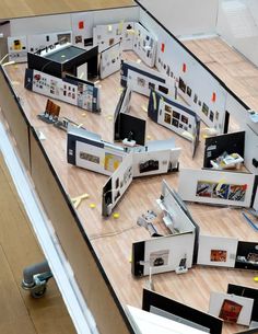 a room filled with lots of different types of appliances on top of a hard wood floor